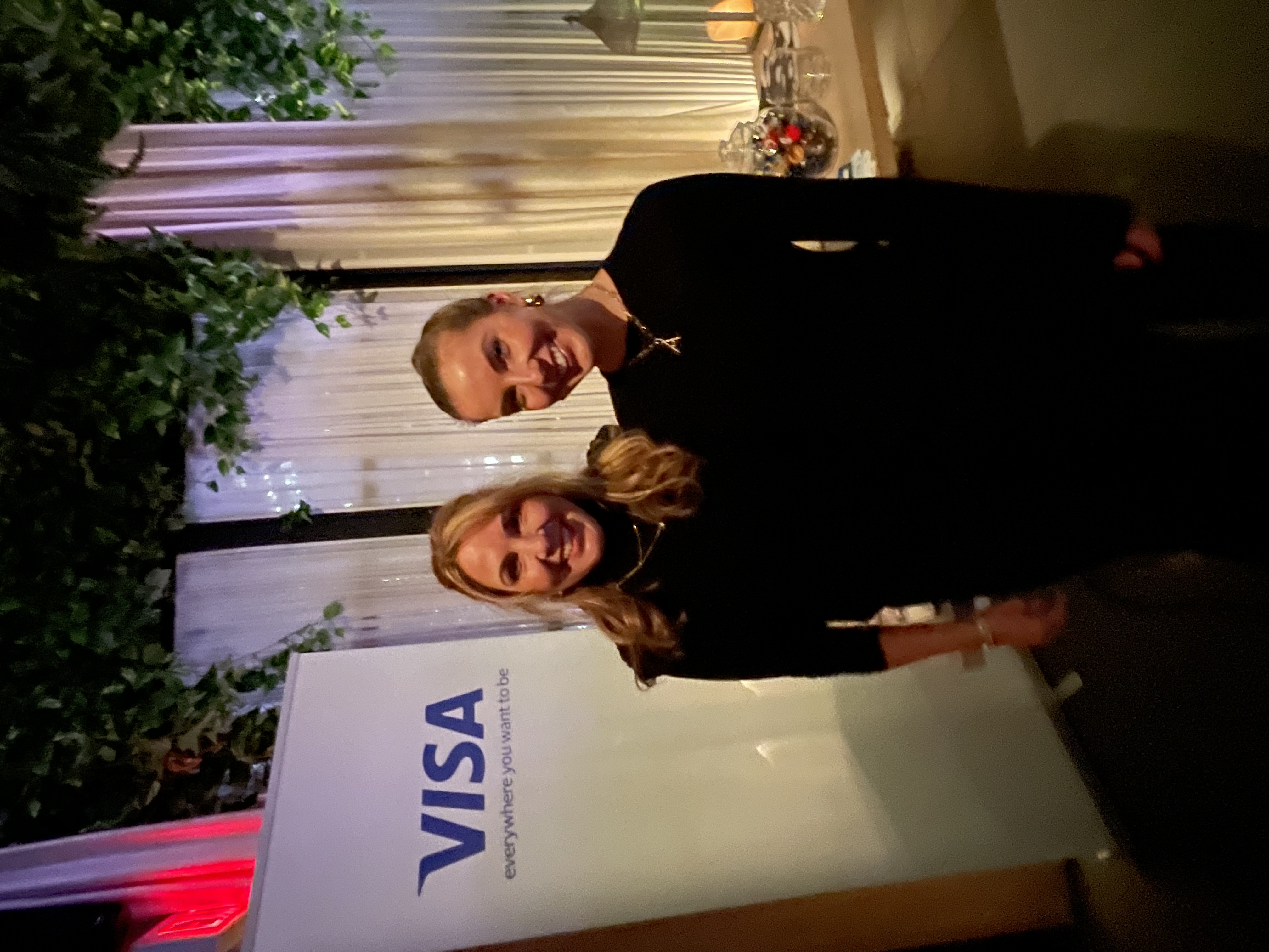 Professional networking moment at a Visa corporate event
